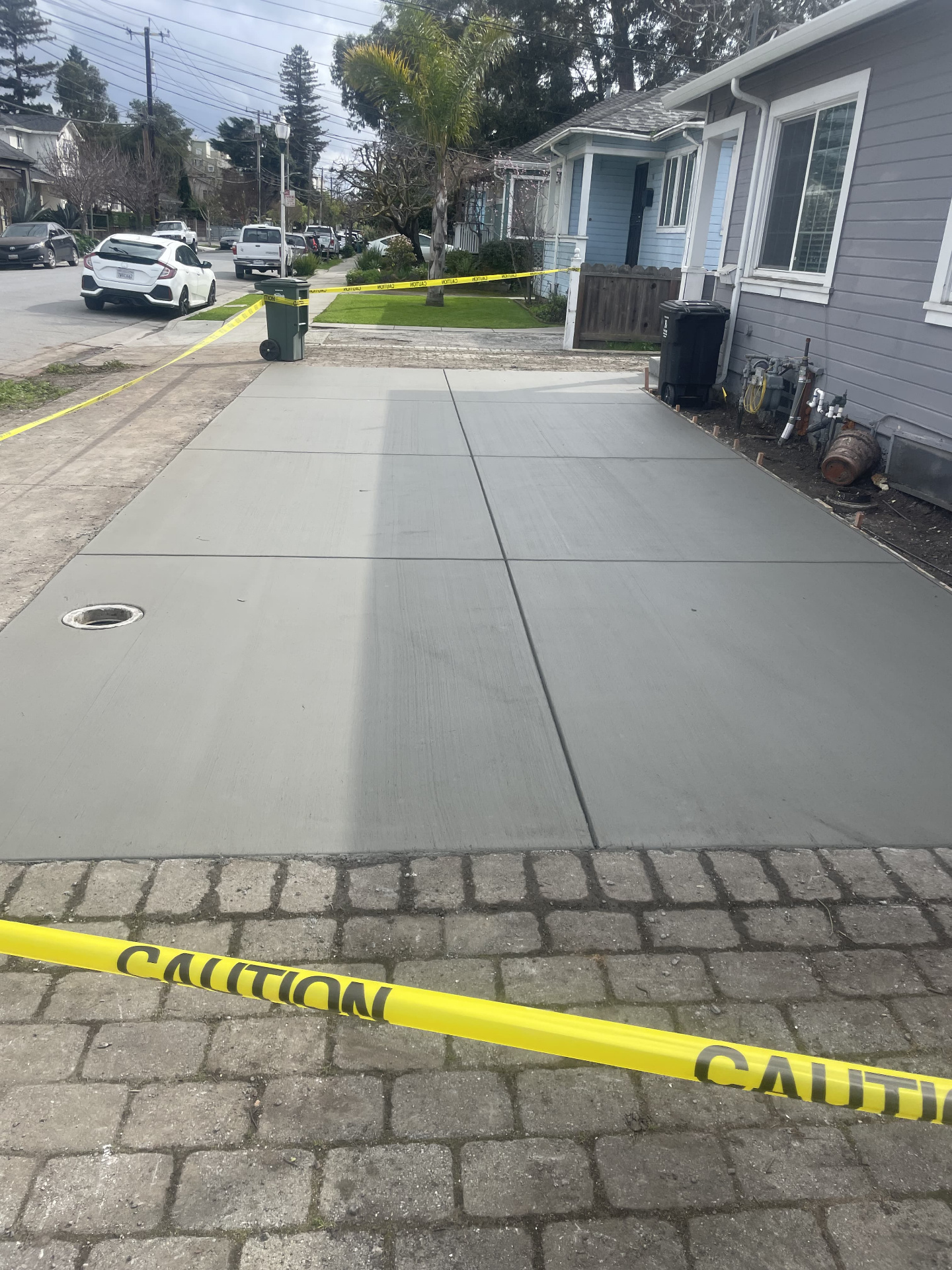 Broom finish concrete driveway with clean control joints