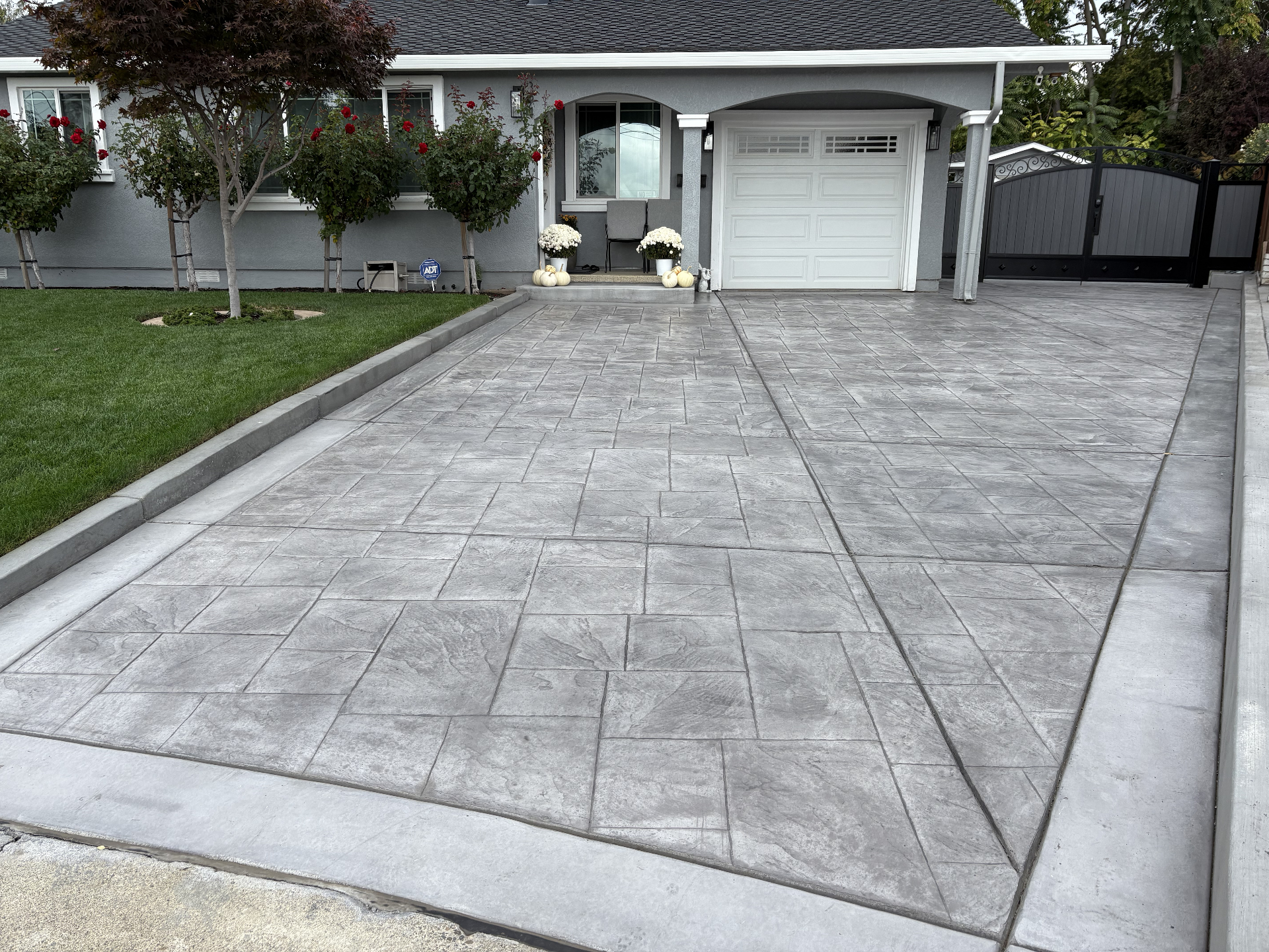 Stamped Concrete Driveway hardscape project by Skygrid Hardscaping